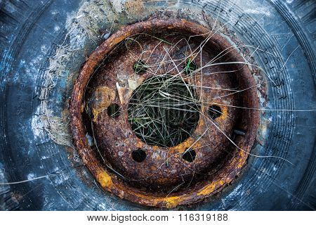 Old Used Tire Cover On The Grass