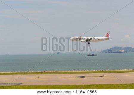 HONG KONG - JUNE 04, 2015: Dragonair aircraft landing at Hong Kong airport. Dragonair is a Hong Kong-based international regional airline