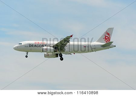 HONG KONG - JUNE 04, 2015: Dragonair aircraft landing at Hong Kong airport. Dragonair is a Hong Kong-based international regional airline