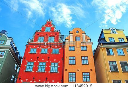 Red and Yellow iconic buildings on Stortorget a small public square in Gamla Stan