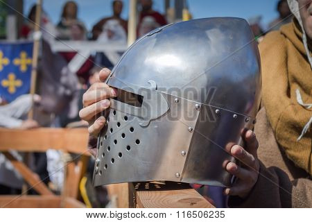The Man On The Knight Tournament Holdind A Knights Helmet