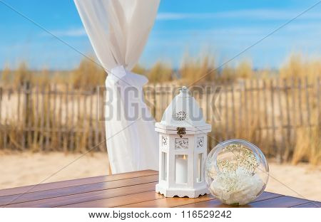 Wedding romantic decoration. Candle in a luminaire.