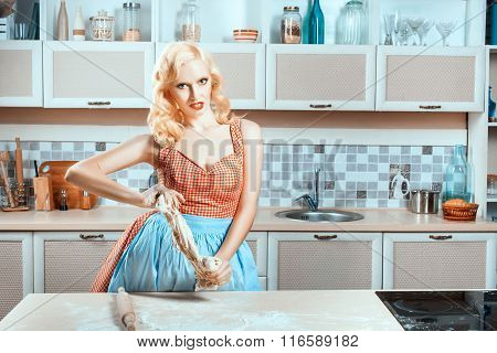 Kitchen Is Woman At Table And Preparing Dinner.