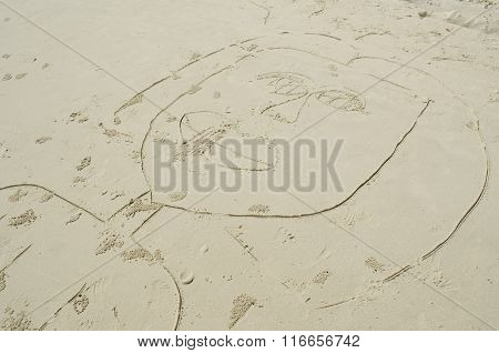 A Child's Drawing Of A Woman On The Sand
