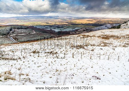 Light Snow Over Fields, Hills And Trees.  Vale Of Neath, South Wales, United Kingdom.