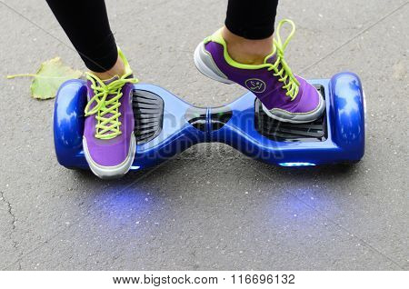 BUCHAREST, ROMANIA, - NOVEMBER 10, 2015: Girl using hoverboard, a self-balancing two-wheeled board.