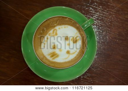 Cup Of Art Cappuccino Coffee On Desk