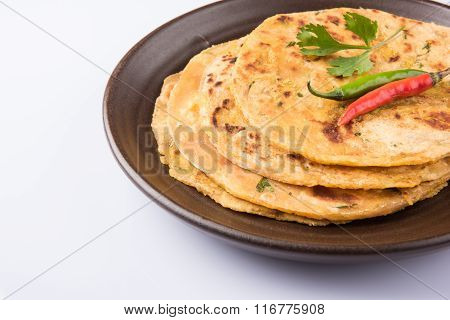 Traditional Indian bread - Aloo paratha or aalu parotha, potato stuffed bread. served with tomato ke
