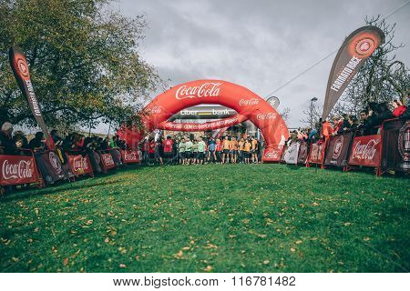 Runners in a extreme obstacle race on start line ready to run