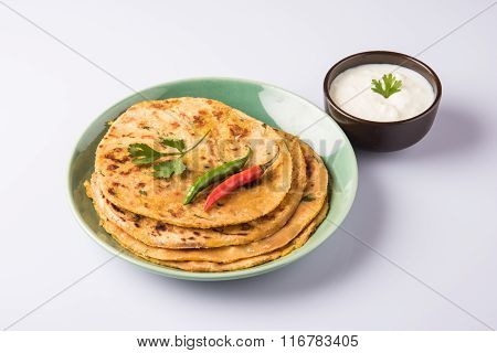 Traditional Indian bread - Aloo paratha or aalu parotha, potato stuffed bread. served with tomato ke