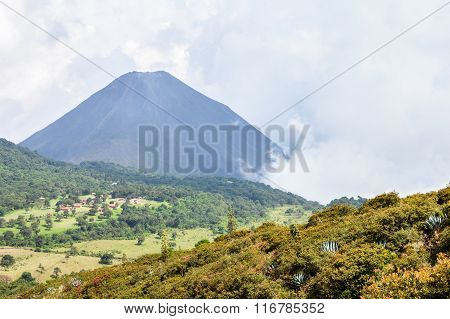 The Hazy Landscape With The Peak Of The Active Izalco Volcano In El Salvador