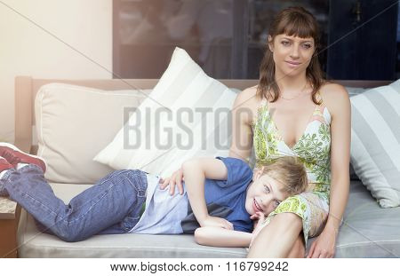 Happy boy and mother relaxing