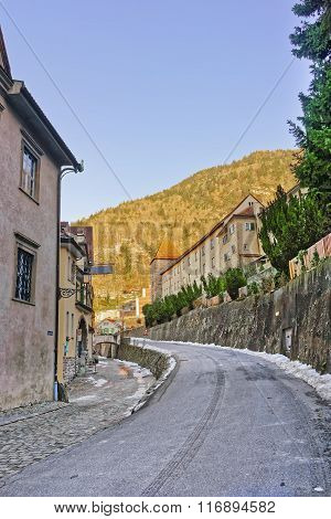 Street view on Chur Old Town and Mountains. Chur is capital of Graubunden in Switzerland. It lies in Alpine Grisonian Rhine valley. The city is the oldest one in Switzerland