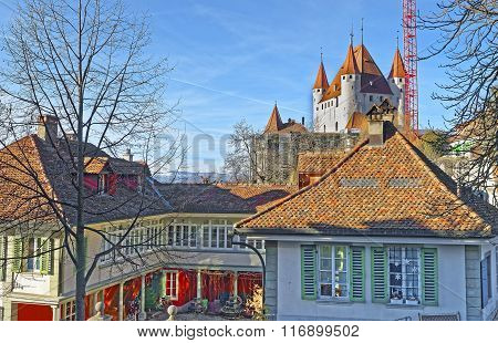 Thun Castle above houses in the Old City of Thun. Thun Castle is a Castle Museum in Thun in Swiss canton of Bern where the Aare river flows out of Lake Thun. Today it is a Switzerland heritage site.