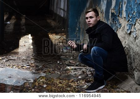 Handsome Young Man Standing In The Destroyed Building, Not Looki