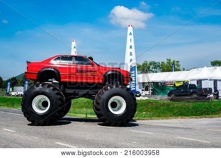 RAYONG THAILAND-NOVEMBER 18 2017 : Red BMW car 4x4 bigfoot parked on asphalt road in Air Race 1 World Cup Thailand 2017 at U-Tapao Naval Air Base