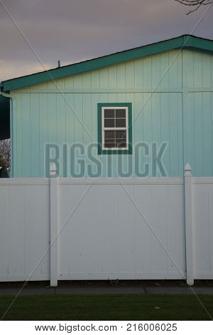 Colorful Typical American House And Fence With Window