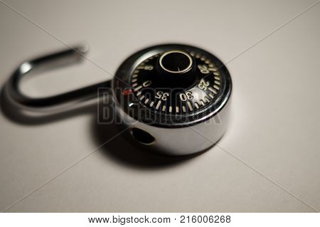 An open metallic combination padlock. It represents several possibilities.