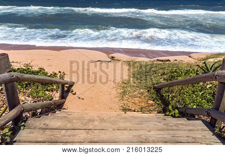 Wooden Pole Barrier On Beach Entrance Sea Landscape