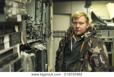 The storeman. Portrait of shelving. Cold weather