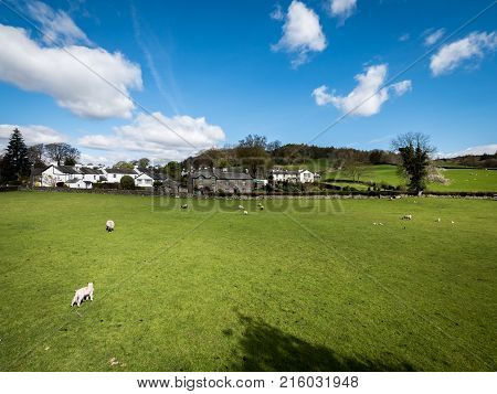 A sunny springtime view of the small Cumbrian village of Near Sawrey in the English Lake District. The village was the home of children's author Beatrix Potter.