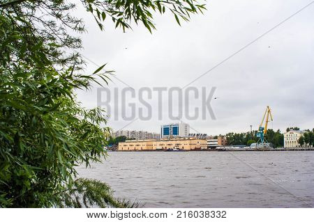 View of indistrial landscape over river from a wild island