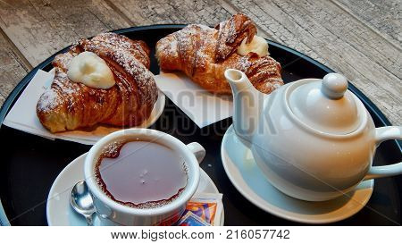 Typical sicilian breakfast in a bar with brioches