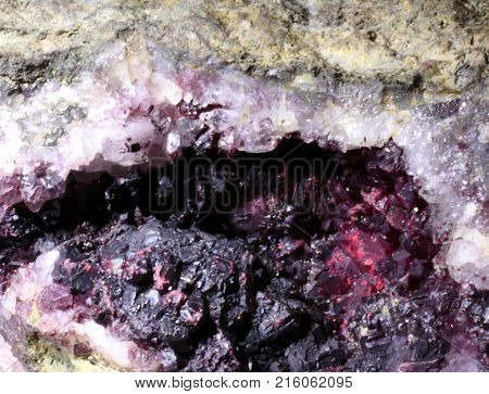 Cinnabarite mineral abstract look glittering, natural phenomenon, closeup photograph. An eyebrow or eye look.