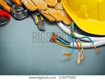 Electrician gloves tools activity yellow objects background