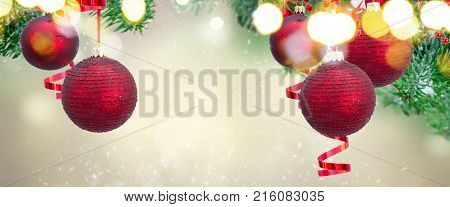 Red christmas balls and evergreen fir tree frame on gray winter background banner