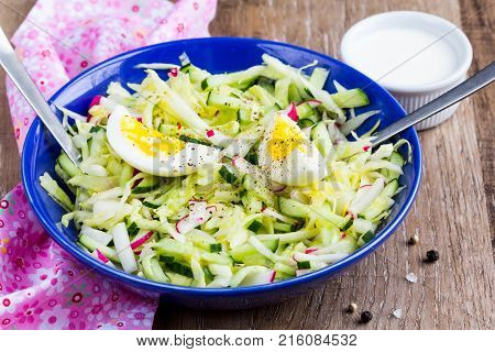 Fresh Salad With Cabbage, Cucumber, Radish And Egg, Healthy Spring Dish In Rustic Style And Bright P