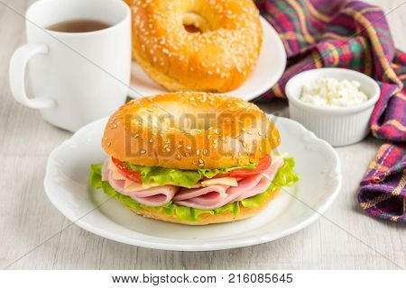 Bagel Sandwich With Ham, Cheese, Tomato, Green Salad Lettuce, Tea, Tatsy Breakfast