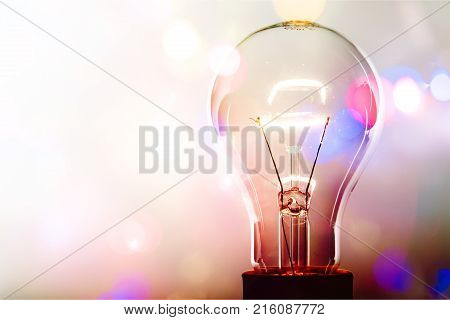 Glass light glowing bulb light bulb background colored