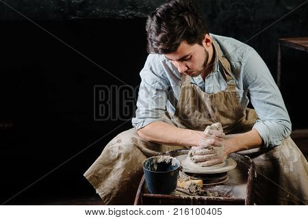 Handsome Young Mexican Potter Does Sketches Of Ceramics On The Paper. Concept Of Small Business, Han
