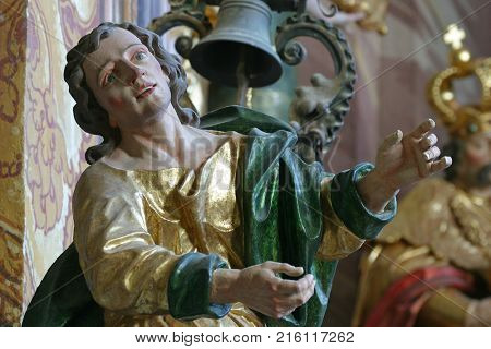 BELEC, CROATIA - NOVEMBER 17: Saint John the Evangelist statue on the pulpit in the Baroque Church of Our Lady of the Snow in Belec, Croatia on November 17, 2011.
