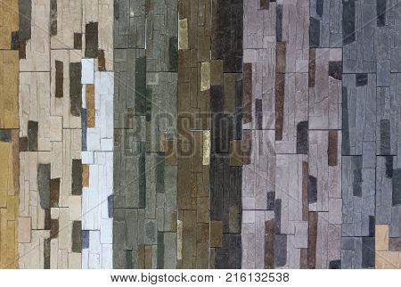 Decorative brick wall from concrete facing tiles as background or texture.