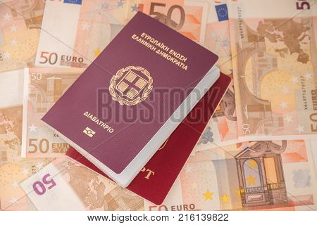 Passports on banknote background. Passports and keys of house. Euro banknotes 50 fifty. Traveling and money.