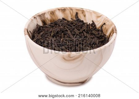 Leaf tea in a pial on a white background isolation
