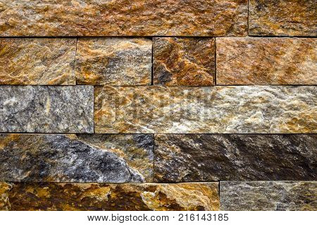 Stone wall texture, travertine tiles facing background