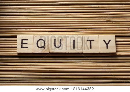 EQUITY word written on wooden cubes. Finance concept