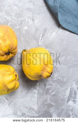 Close up of ripe quince fruits on kitchen counter top.