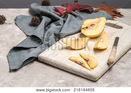 Close up of ripe quince fruits on kitchen counter top.