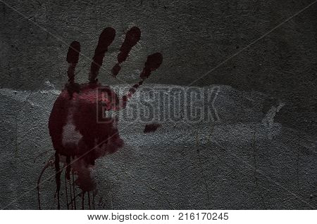 Blood of hand on a wall in an abandoned house them.The story about the murder.Background operators in Halloween festivities.