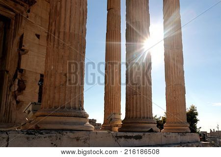 Parthenon temple on the Acropolis of Athens with lights go through, Greece.