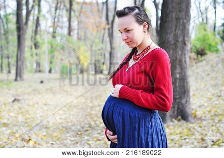 Pregnant woman. Pregnancy. A photo of a cute caucasian pregnant woman.