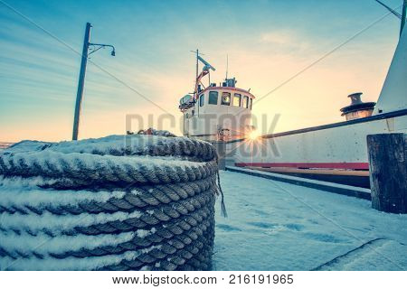 Old fisherman iron boat in Iceland, grunge colored design