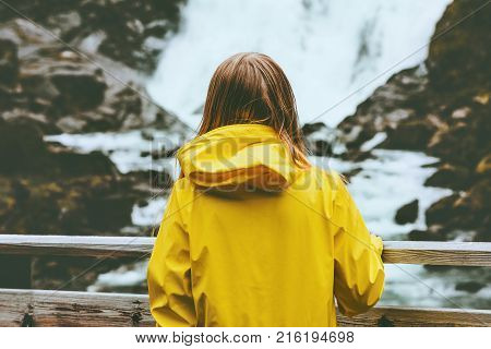 Traveler woman walking outdoor Travel Lifestyle wanderlust concept adventure active vacations girl looking at waterfall