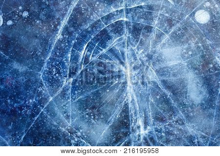 beautiful broken blue ice with cracks and bubbles