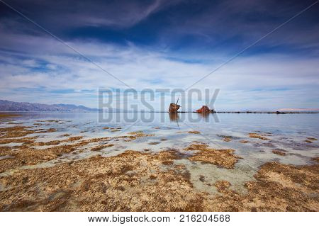 Low tide in the Nabq national park. shipwreck on the horizon. Egypt.