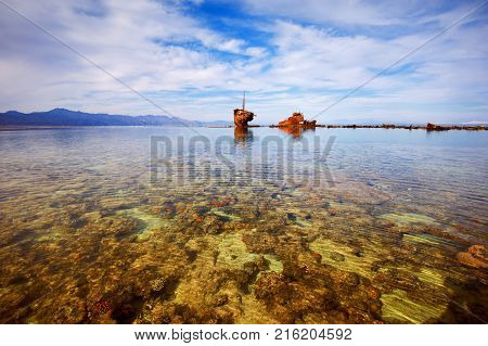 Low tide in the Nabq national park. shipwreck on the horizon. Egypt.